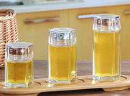 中国 小さいガラス蜂蜜はふたが付いている化粧品のための震動しましたり/透明なガラス貯蔵の瓶 工場